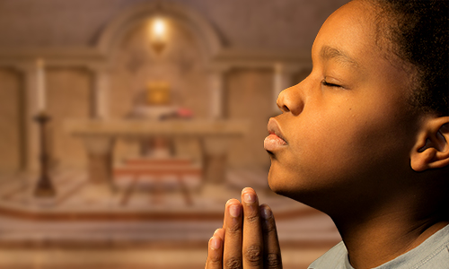 Faith-In-Action-Annunciation-Catholic-School A young DC boy practicing his Catholic Faith at Annunciation Catholic School